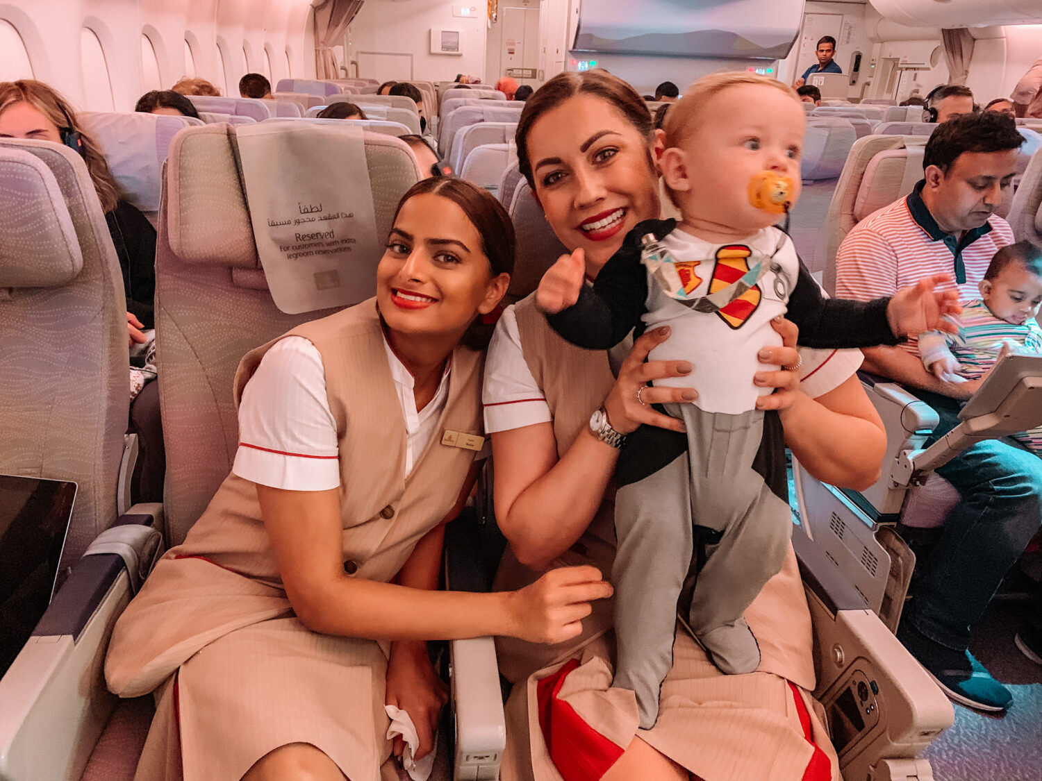 gemma and george, baby george playing with flight hostess on dubai flight